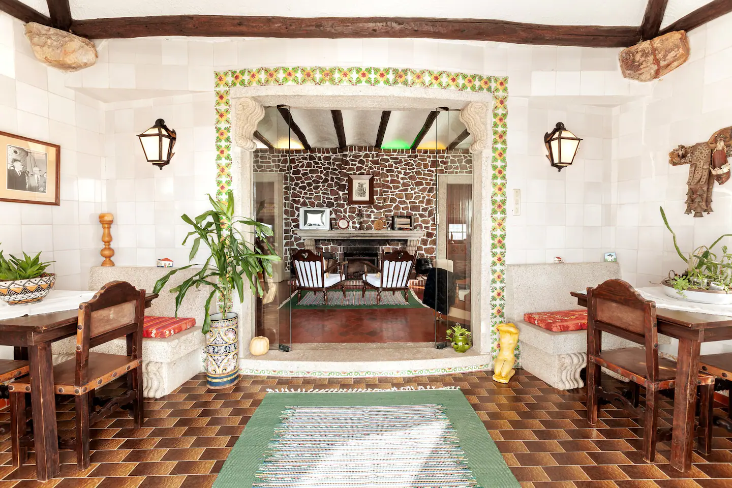Traditional dining and sitting rooms connected by a tiled arch